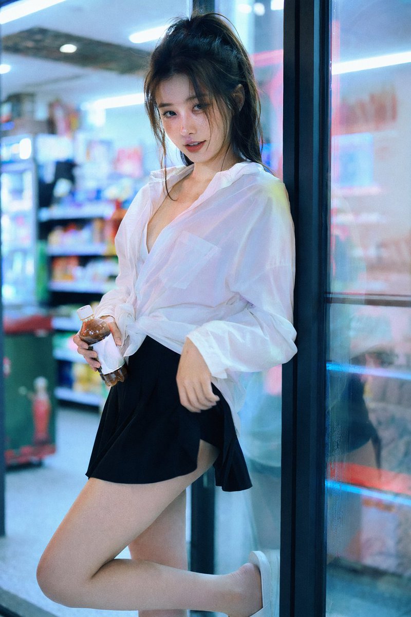 35mm Film: Convenience Store Neon Portrait — Sora 2 Prompt
