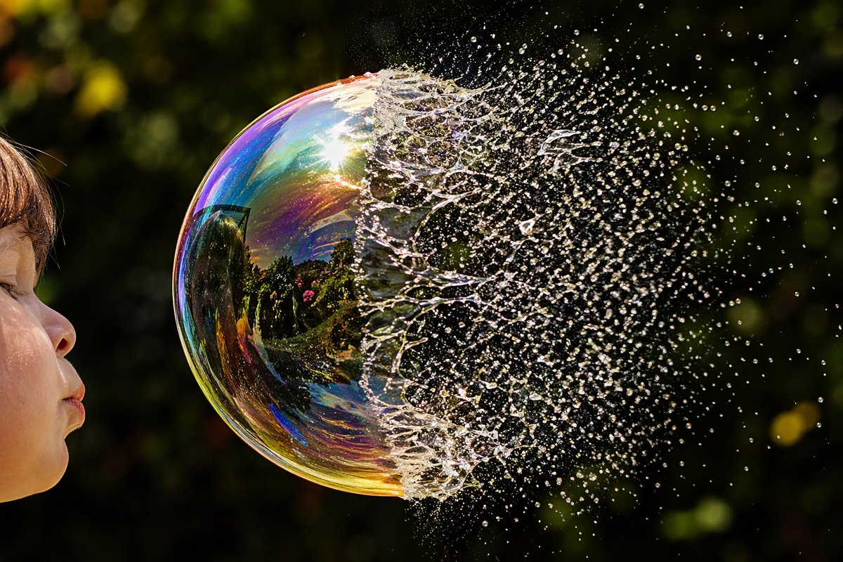 Child Blowing Bursting Soap Bubble — Sora 2 Prompt