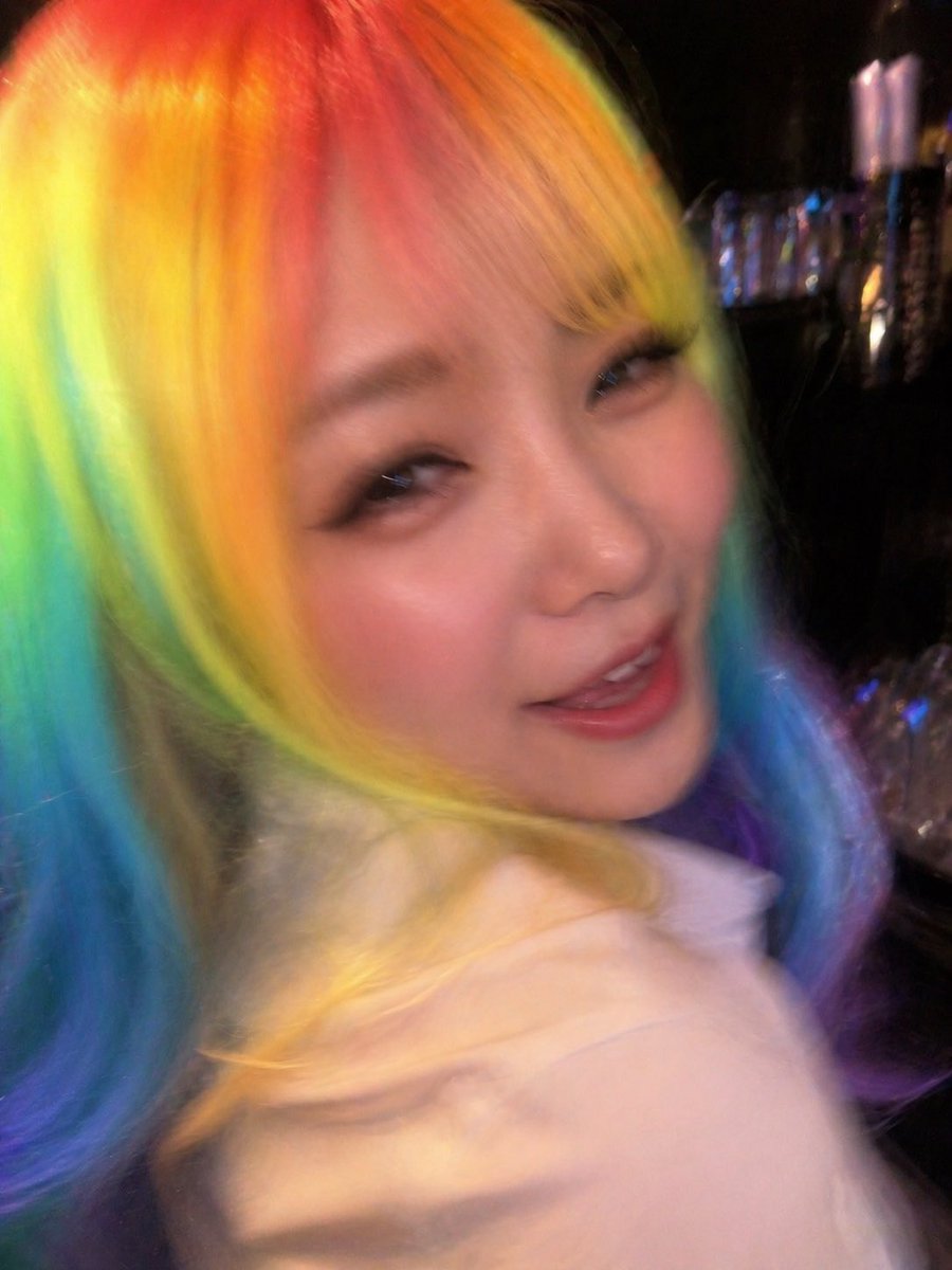 Awkward Nightclub Snapshot with Rainbow Hair — Sora 2 Prompt