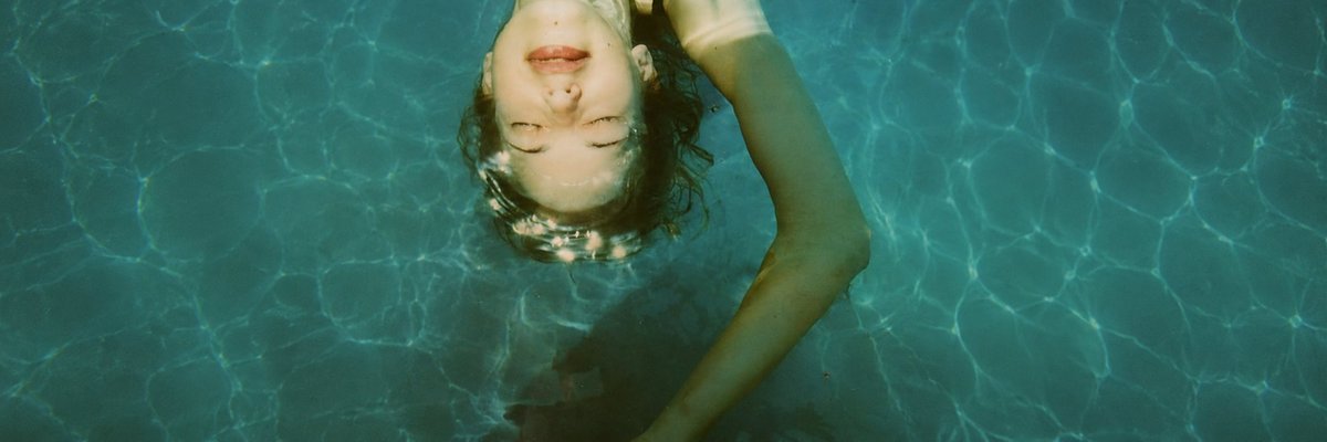 Overhead Pool Swimmer — Cinematic Wide Sora 2 Prompt